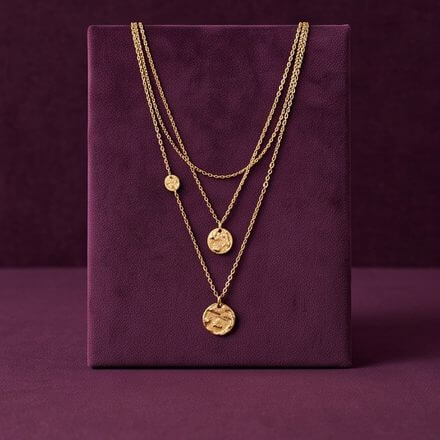 Layered gold necklaces