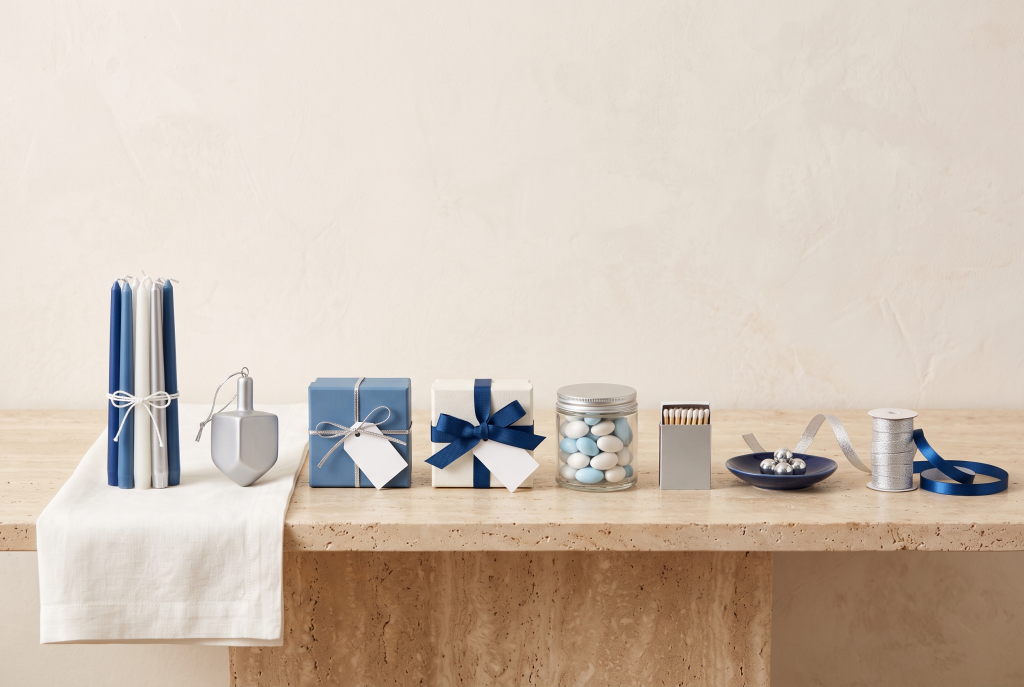 Eight small coordinated gifts grouped as a Hanukkah set, one for each night